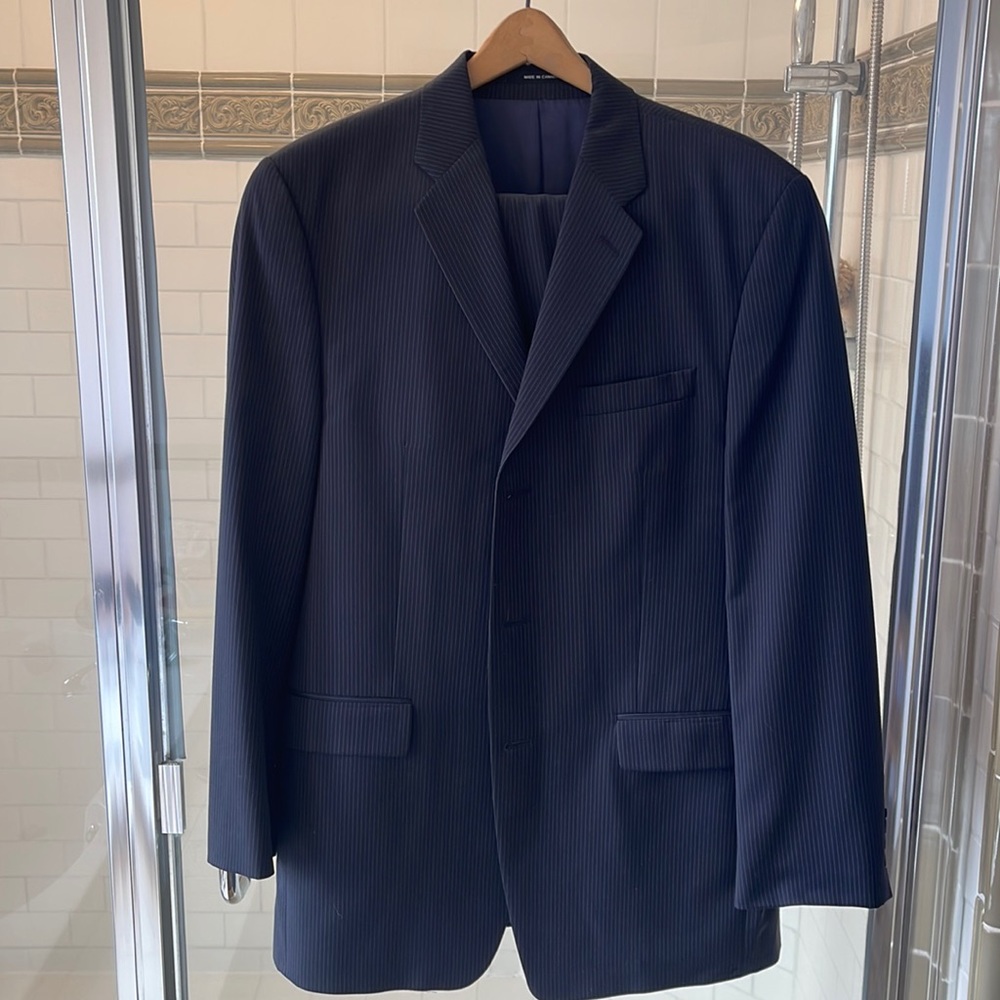Calvin Klein Suit, worn once in great condition. Blue with pinstripes.